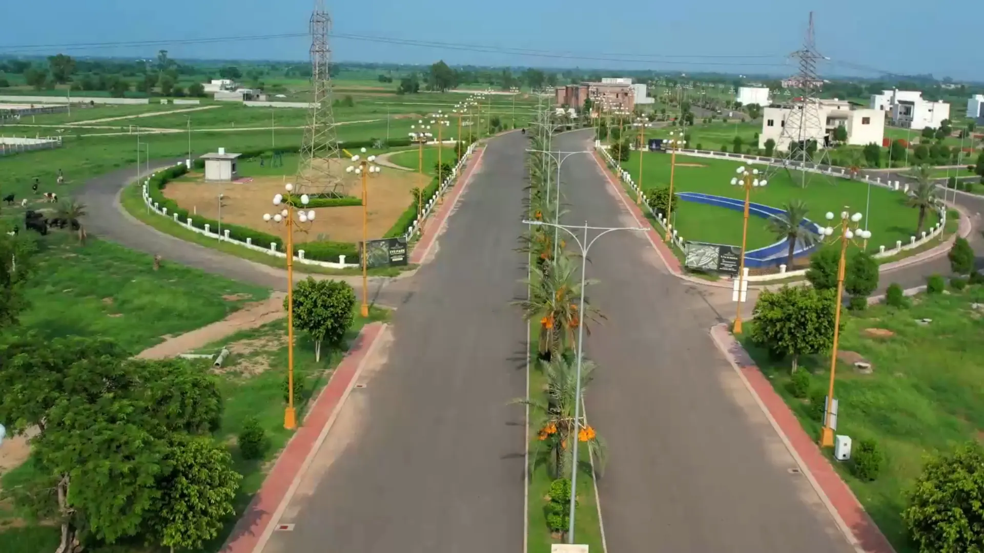 Aerial view of Golden Gate City main boulevard with residential plots and street lighting